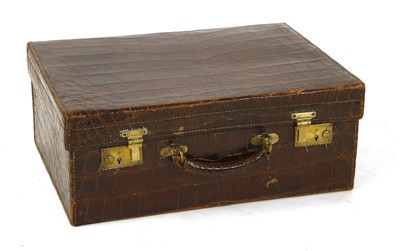 Lot 746 - A crocodile skin suitcase