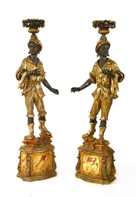 Lot 614 - A pair of Florentine-style carved wooden blackamoor torchères