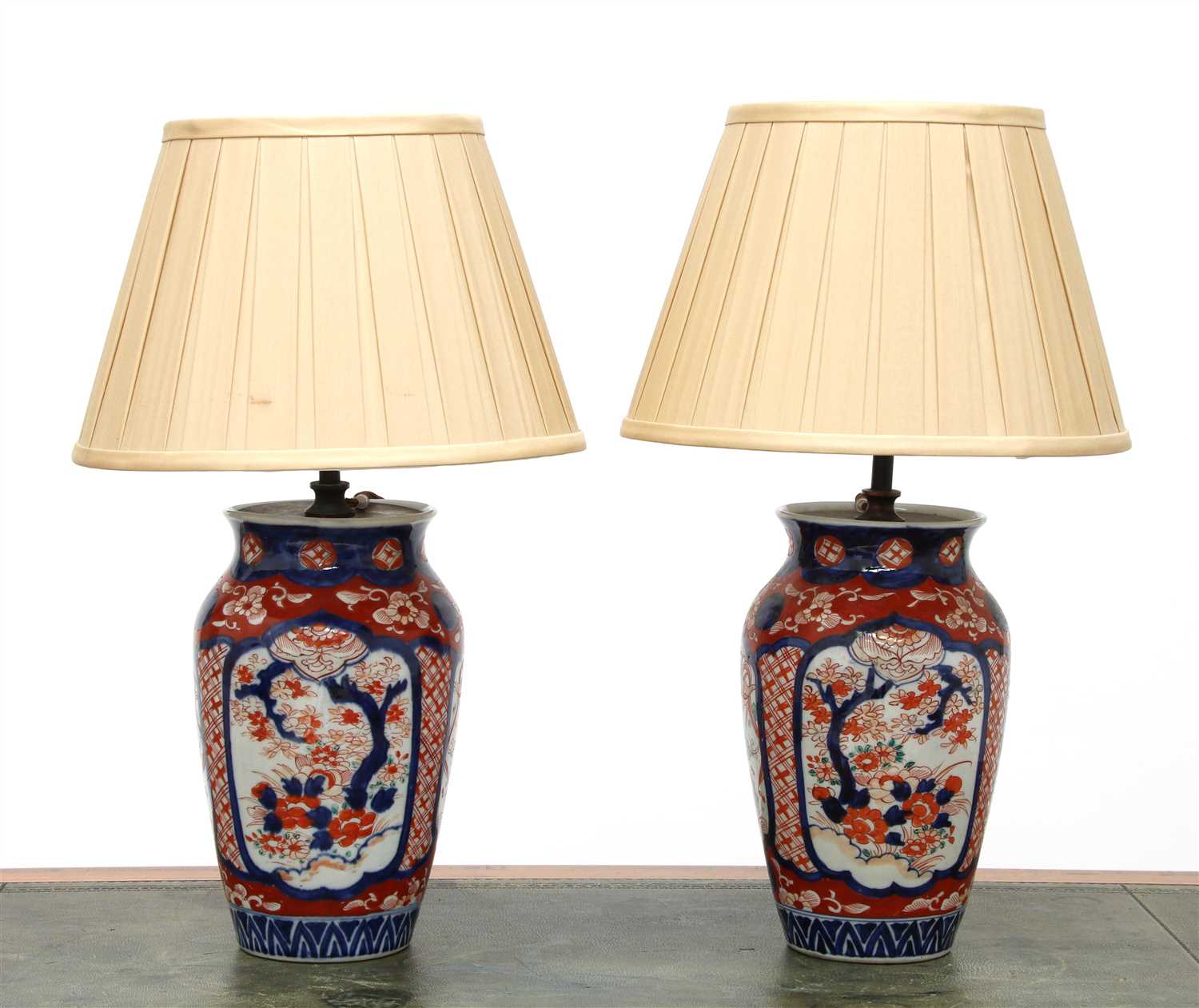 Lot 204 - A pair of Imari vase table lamps