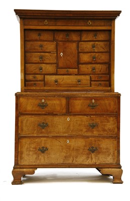 Lot 450 - An early 18th century and later walnut cabinet on chest