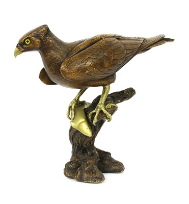 Lot 246 - A modern moulded and brass figure of an eagle