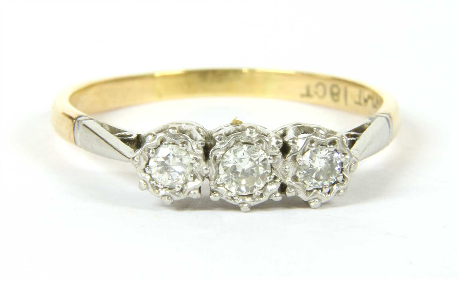 Lot 22 - A three stone diamond ring