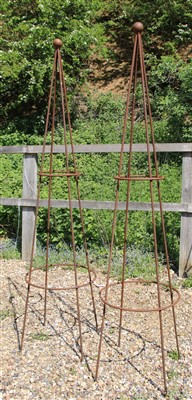 Lot 478 - A pair of hand forged wrought iron garden obelisks