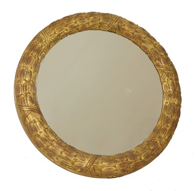 Lot 626 - A carved giltwood circular wall mirror