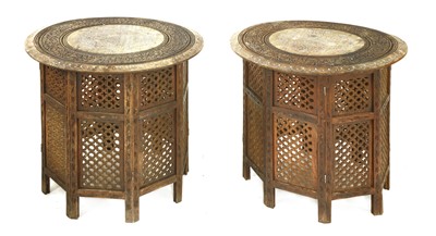 Lot 689 - A pair of Indian hardwood side tables