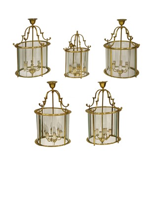 Lot 668 - A set of four George III-style brass hall lanterns