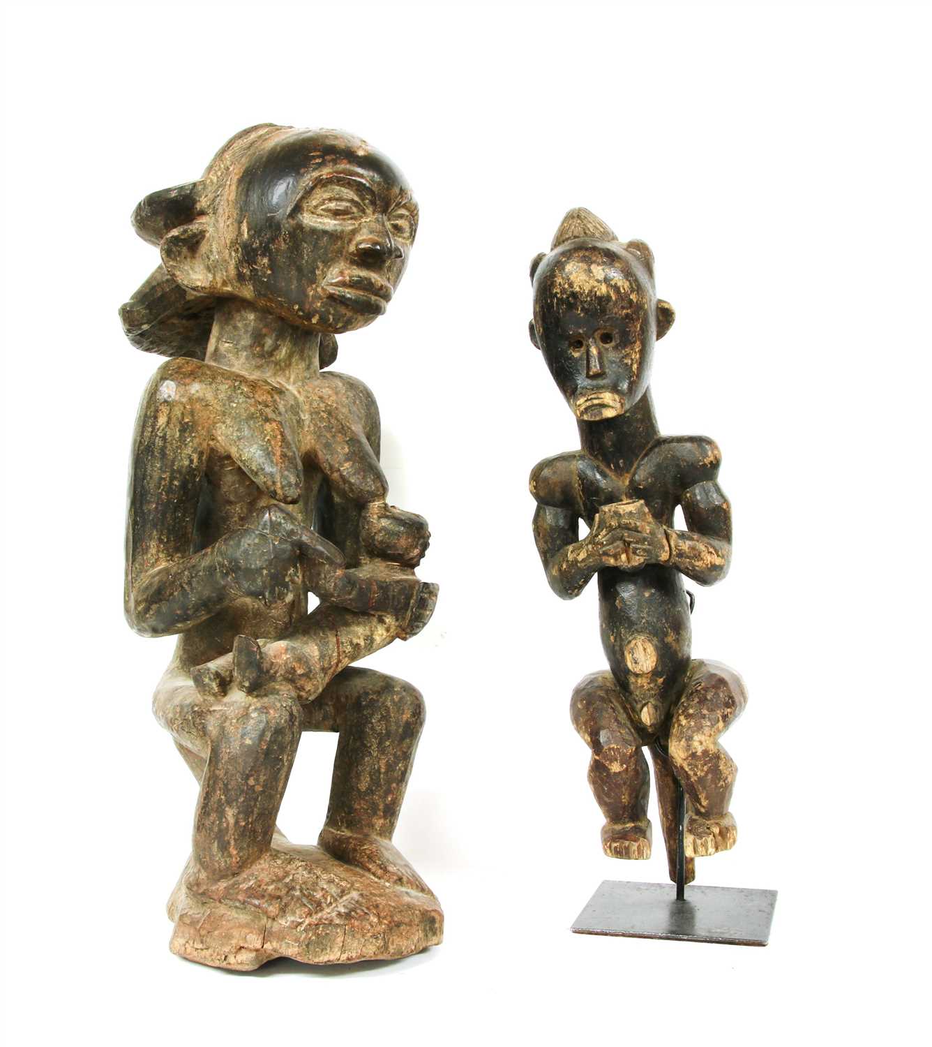 Lot 202 - Two African carved softwood fertility figures