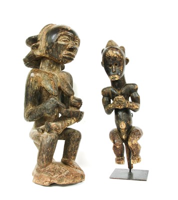 Lot 202 - Two African carved softwood fertility figures