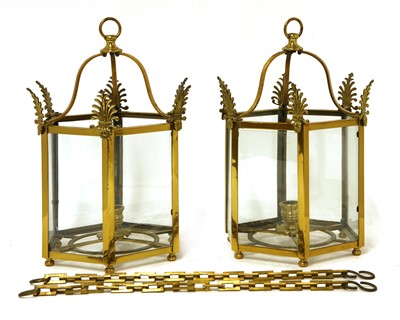 Lot 645 - A pair of Regency-style brass hall lanterns