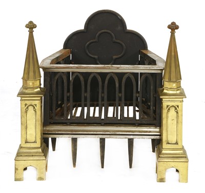 Lot 729 - A Gothic-style fire grate and andirons