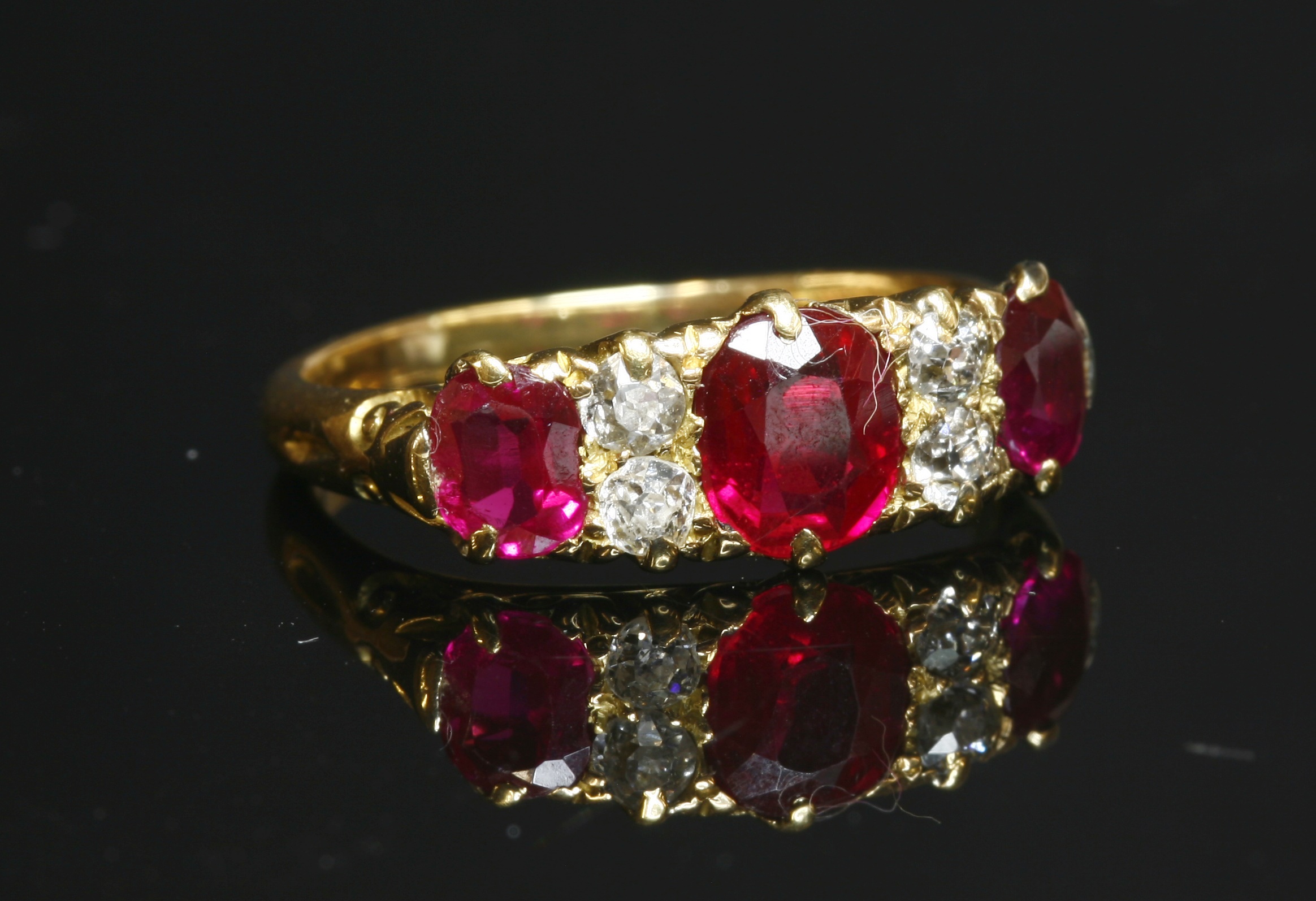 Lot 63 - An 18ct gold synthetic ruby and diamond