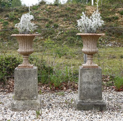 Lot 578 - A pair of cast iron urns