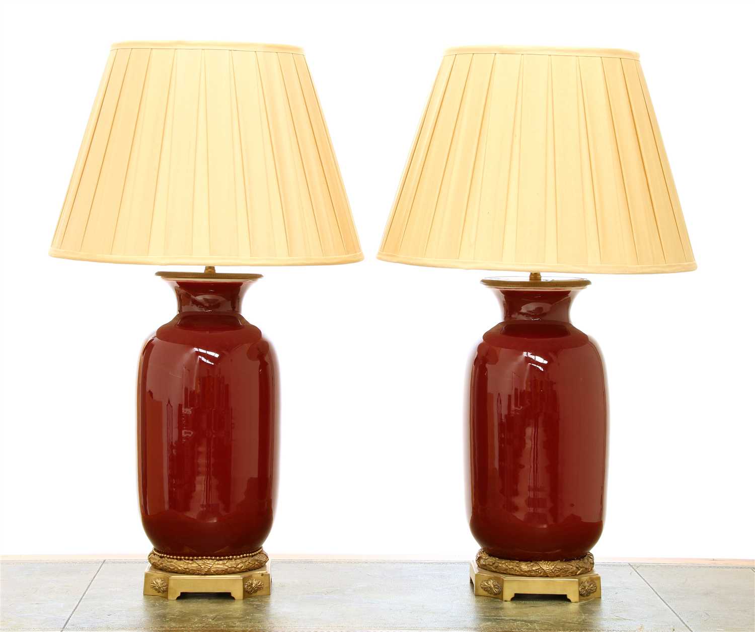 Lot 57 - A pair of modern sang-de-boeuf vase table lamps