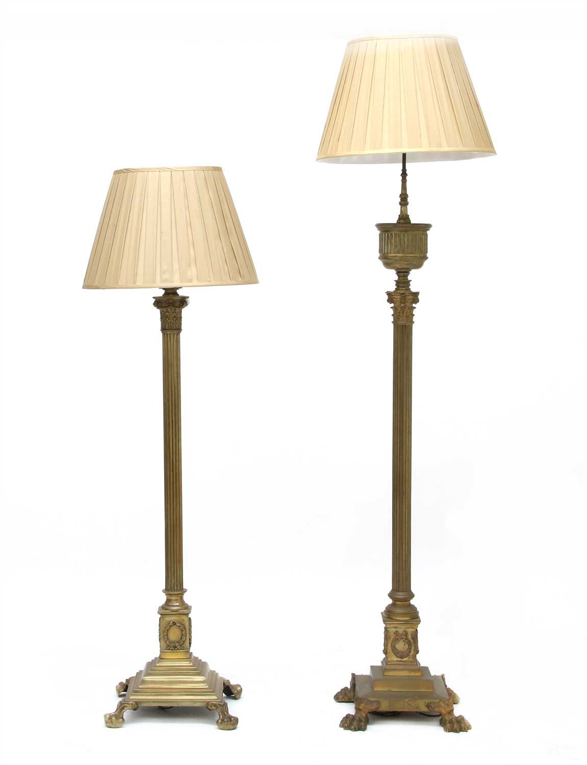Lot 128 - Two brass standard lamps