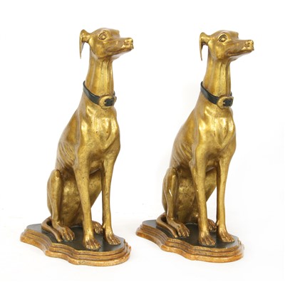 Lot 608 - A pair of parcel-gilt seated whippets