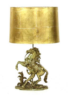 Lot 563 - A brass table lamp in the form of a Marly horse