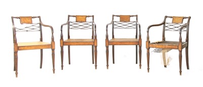 Lot 555 - A set of four Sheraton mahogany armchairs