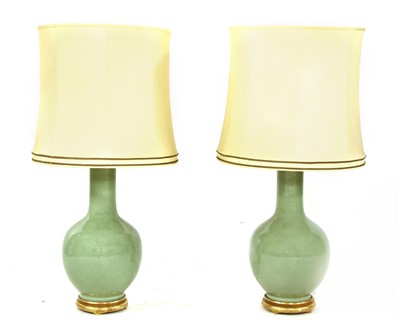 Lot 552 - A pair of large celadon glazed table lamps