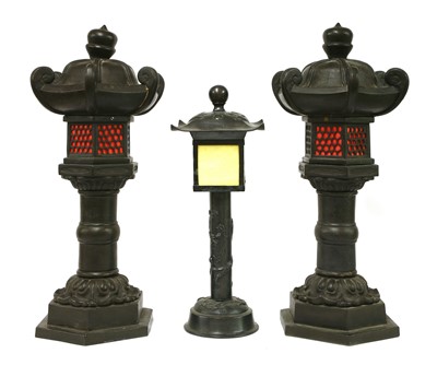 Lot 686 - A pair of pewter table lamps