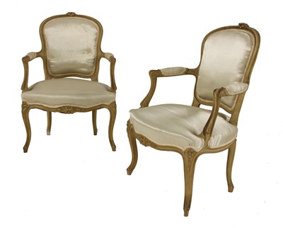 Lot 675 - A pair of French beech armchairs