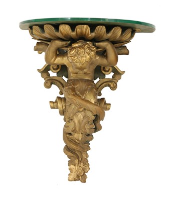 Lot 420 - A carved wooden and composite wall bracket