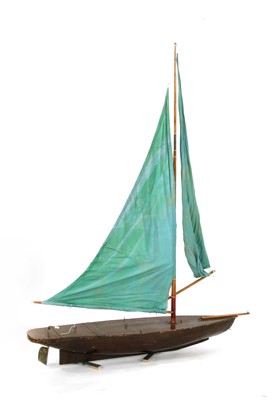Lot 213 - A vintage pond yacht, complete with sail