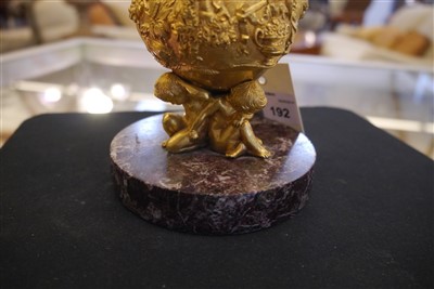 Lot 192 - An ormolu inkwell, cover and liner