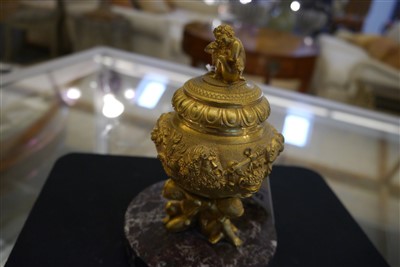 Lot 192 - An ormolu inkwell, cover and liner