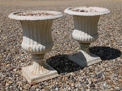 Lot 500 - A pair of cast iron campana urns