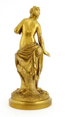 Lot 195 - A gilt bronze figure holding a dove