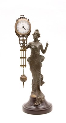 Lot 126 - A modern bronzed metal mystery clock