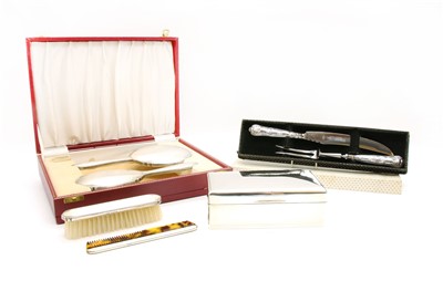 Lot 104 - A cased silver four piece brush and mirror set