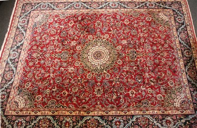 Lot 363 - A large Isfahan style red ground carpet