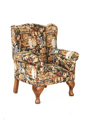 Lot 248 - A child's wing back armchair