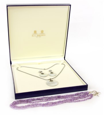 Lot 28A - A silver mounted three row amethyst bead necklace