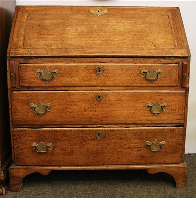 Lot 411 - A Georgian oak bureau