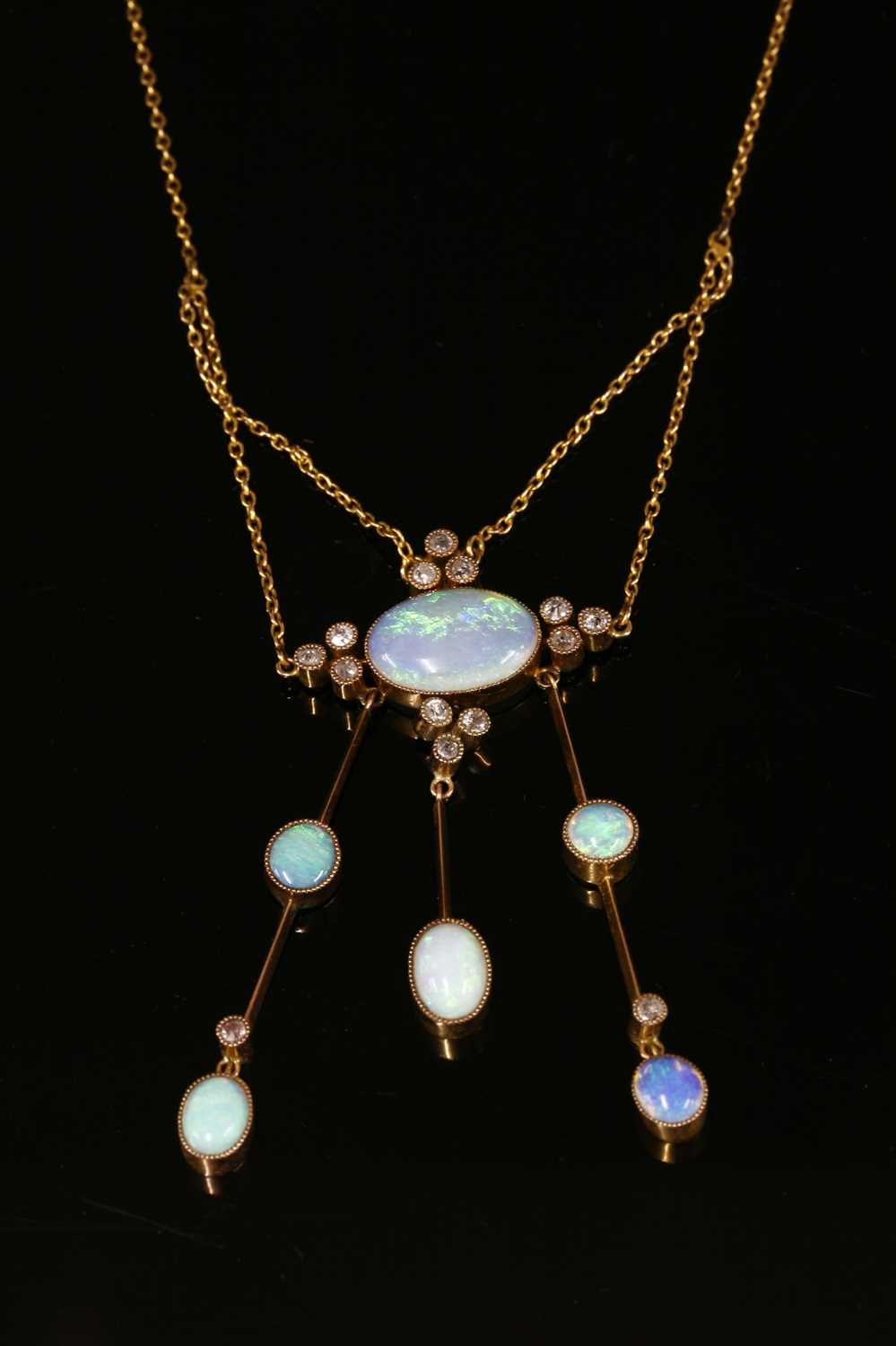 Lot 90 - An Edwardian opal and diamond négligée pendant