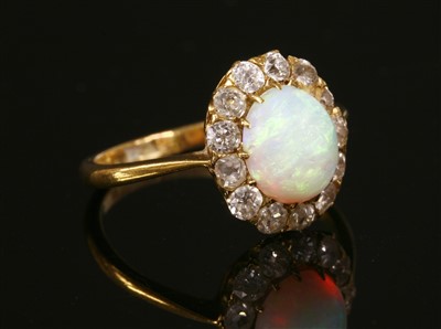 Lot 91 - An opal and diamond cluster ring