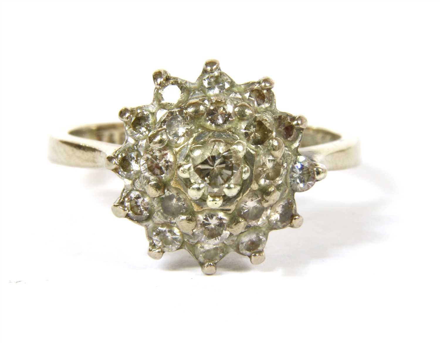 Lot 5 - An 18ct white gold three tier diamond cluster ring
