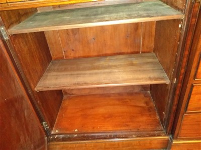 Lot 130 - A George III-style mahogany breakfront bookcase
