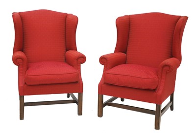 Lot 339 - A pair of George III-style wing back armchairs
