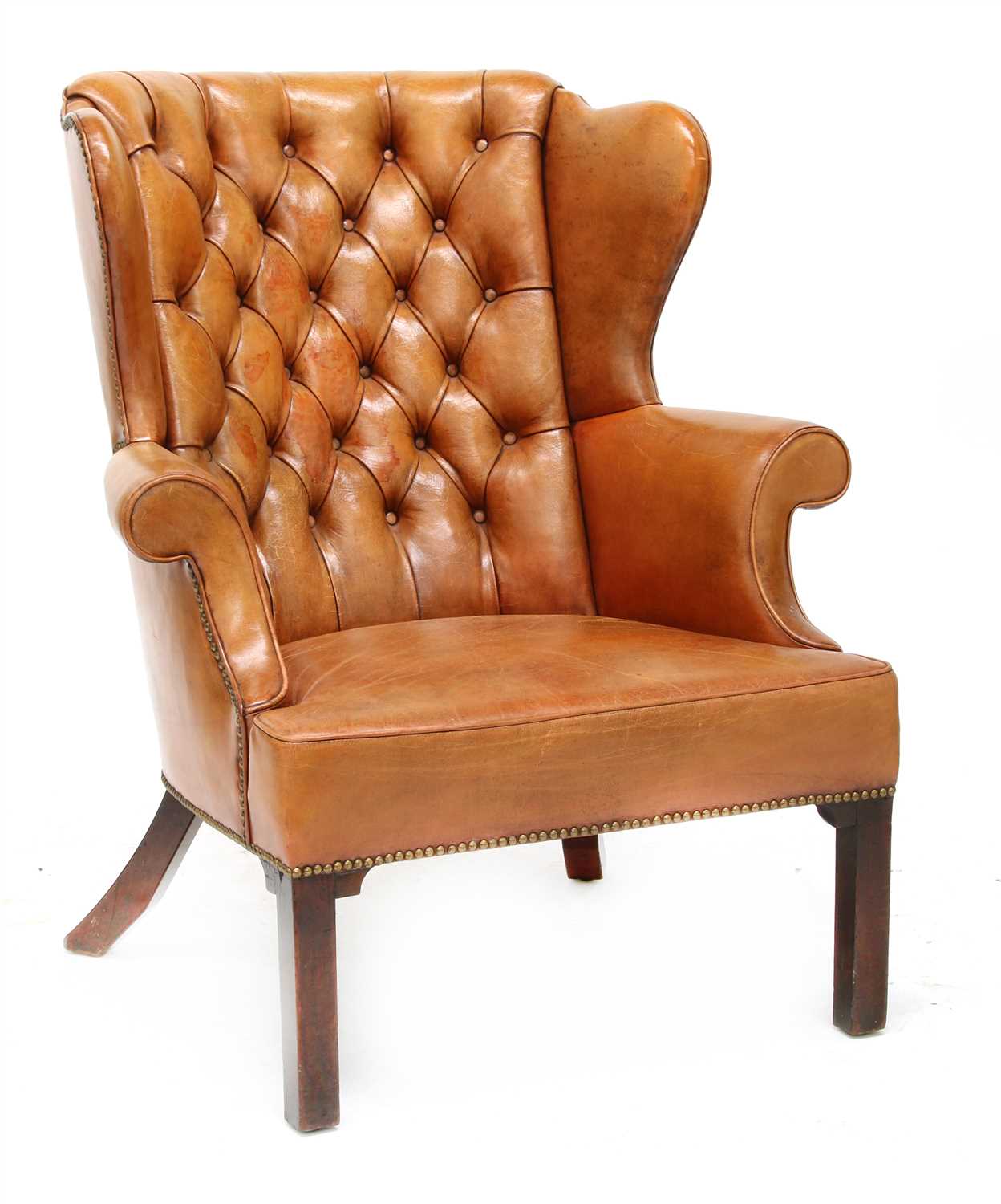Lot 126 - A wing armchair