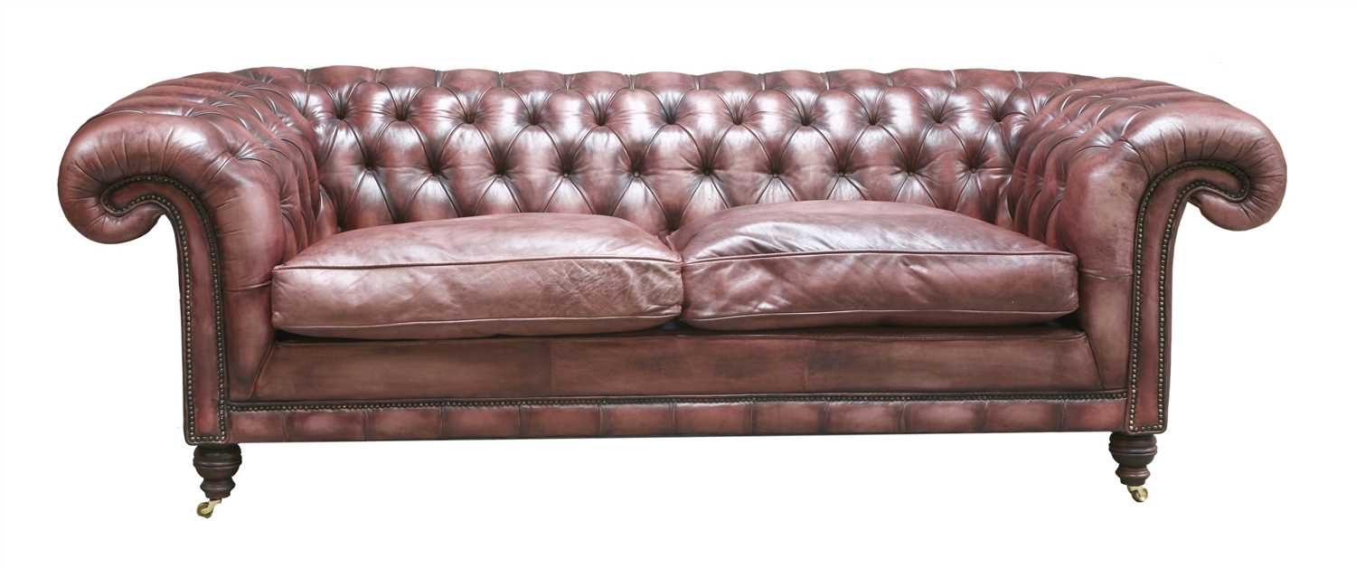 Lot 119 - A modern leather three-seater chesterfield settee