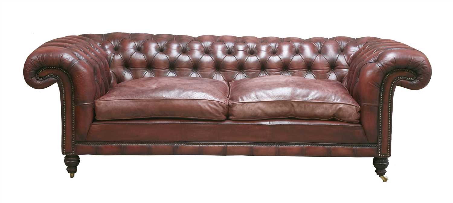Lot 120 - A modern leather three-seater chesterfield settee