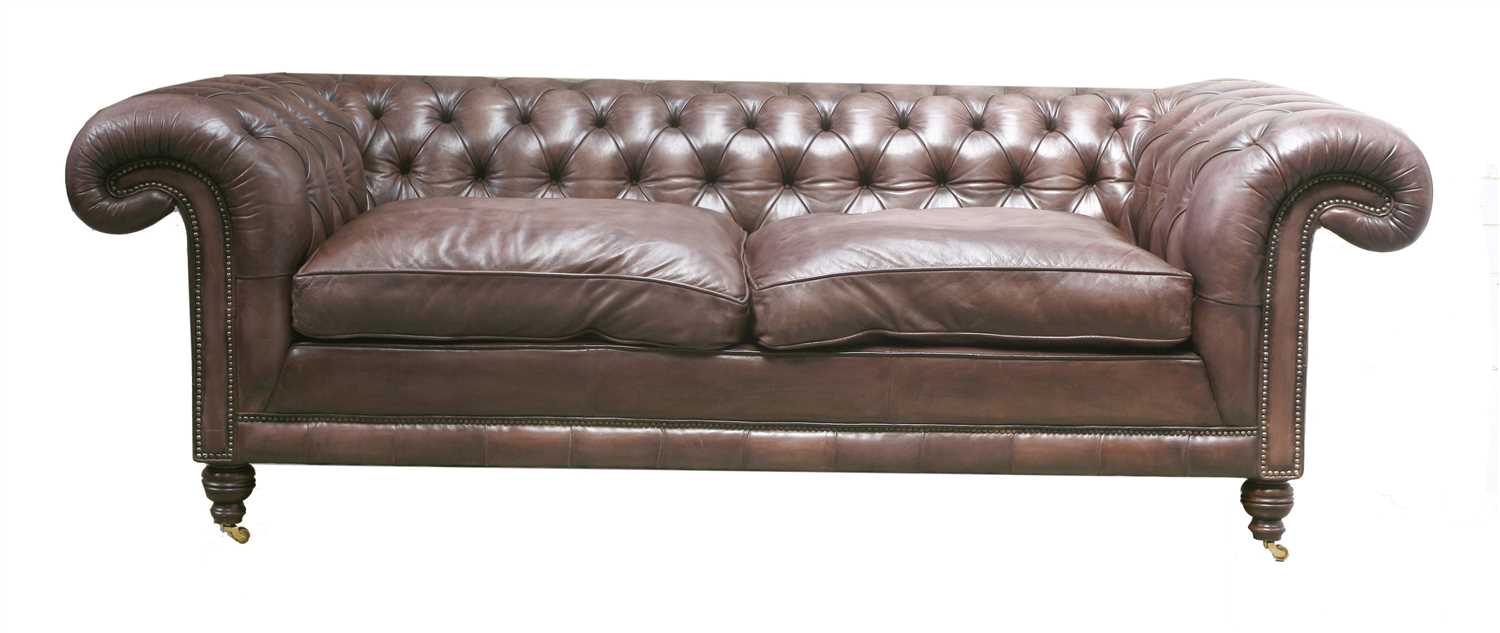 Lot 131 - A modern leather three-seater chesterfield settee