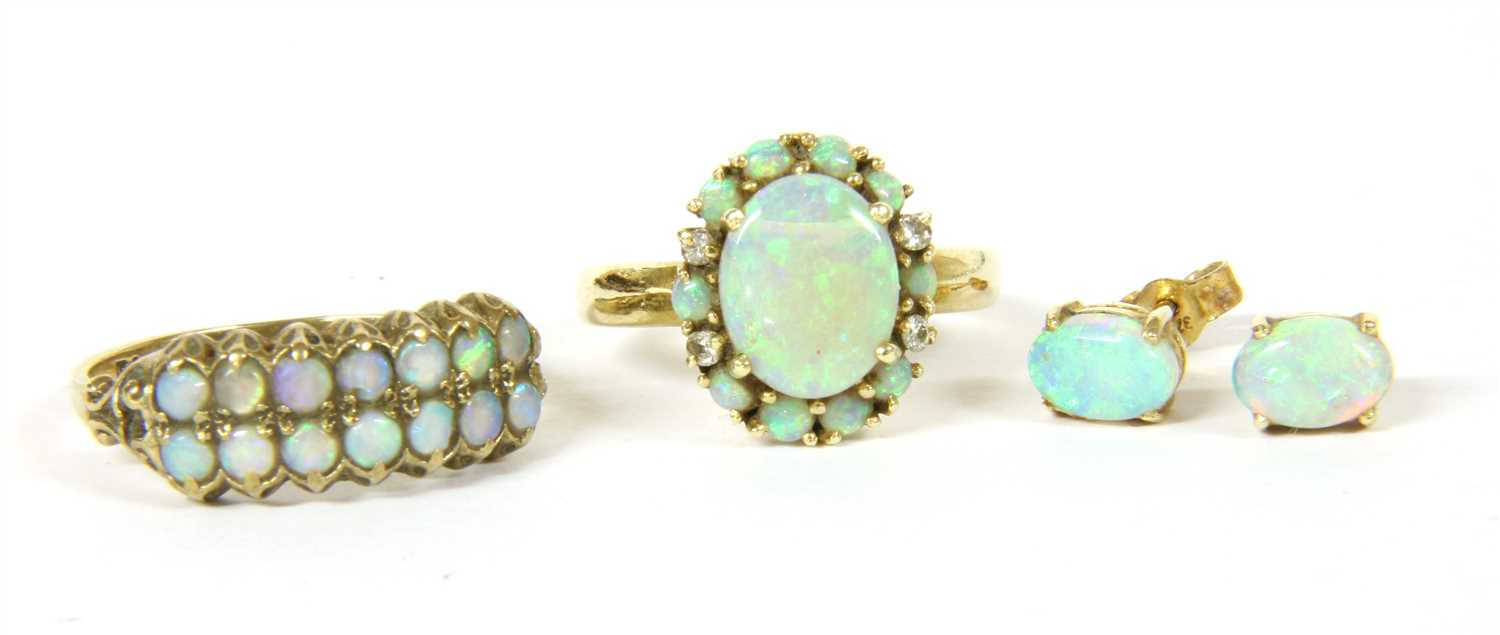 Lot 18 - A Continental opal cluster ring