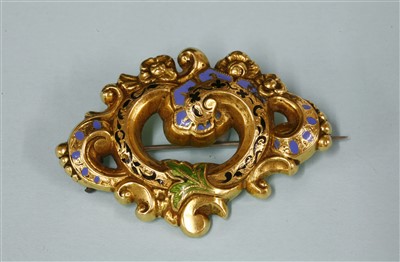 Lot 19 - A Victorian gold and enamel scrolling foliate brooch