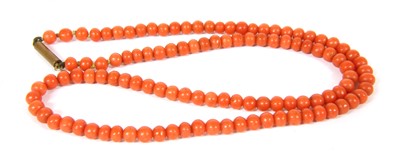 Lot 33 - A single row uniform coral bead necklace