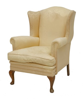 Lot 359 - A wing armchair