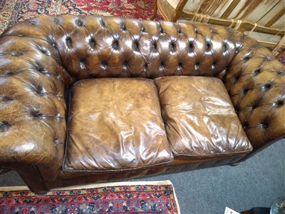 Lot 247 - A modern leather upholstered two-seater chesterfield settee